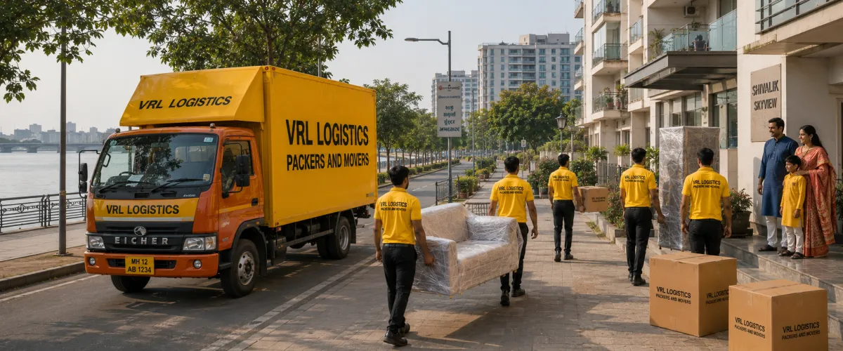 Packers and Movers in Ahmedabad — VRL Logistics team loading a branded moving truck for a household relocation